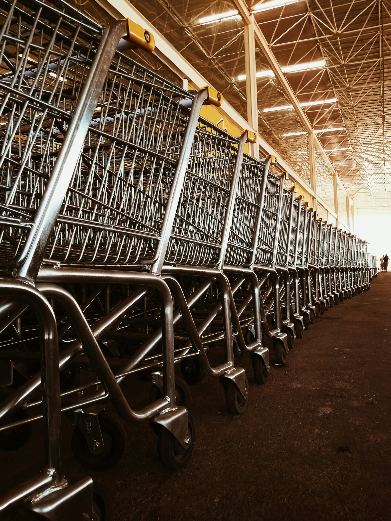 a row of shopping carts in a warehouse